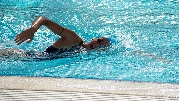 person swimming in pool